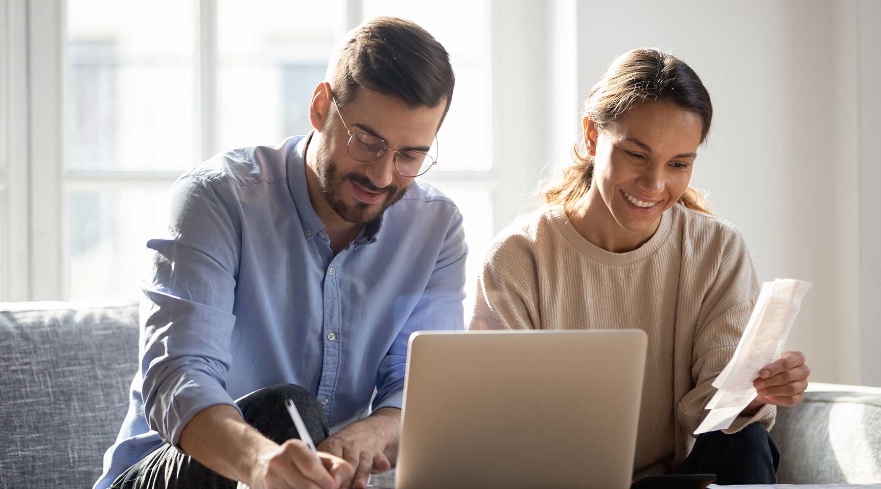 A couple goes through online Life Insurance quotes from Corebridge Direct before filling out their application.