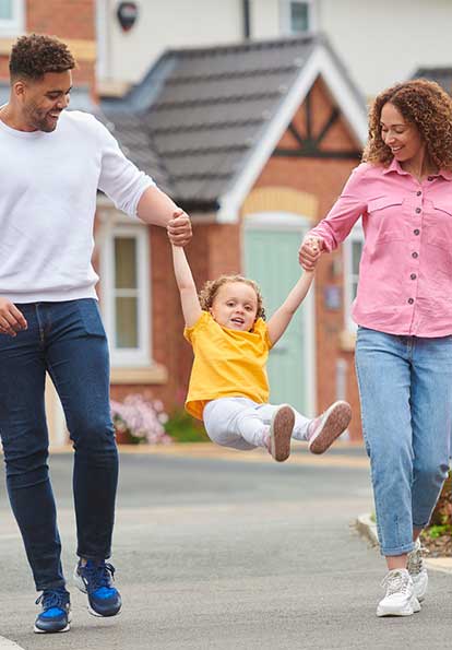 Happy family playing with child