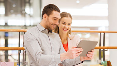 A couple looks through different types of Life Insurance to choose one that caters to their family’s needs. 