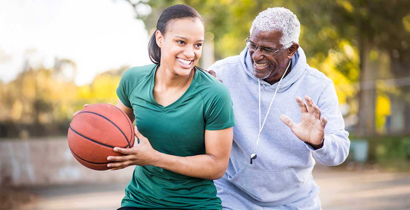 A happy family sits around the breakfast table