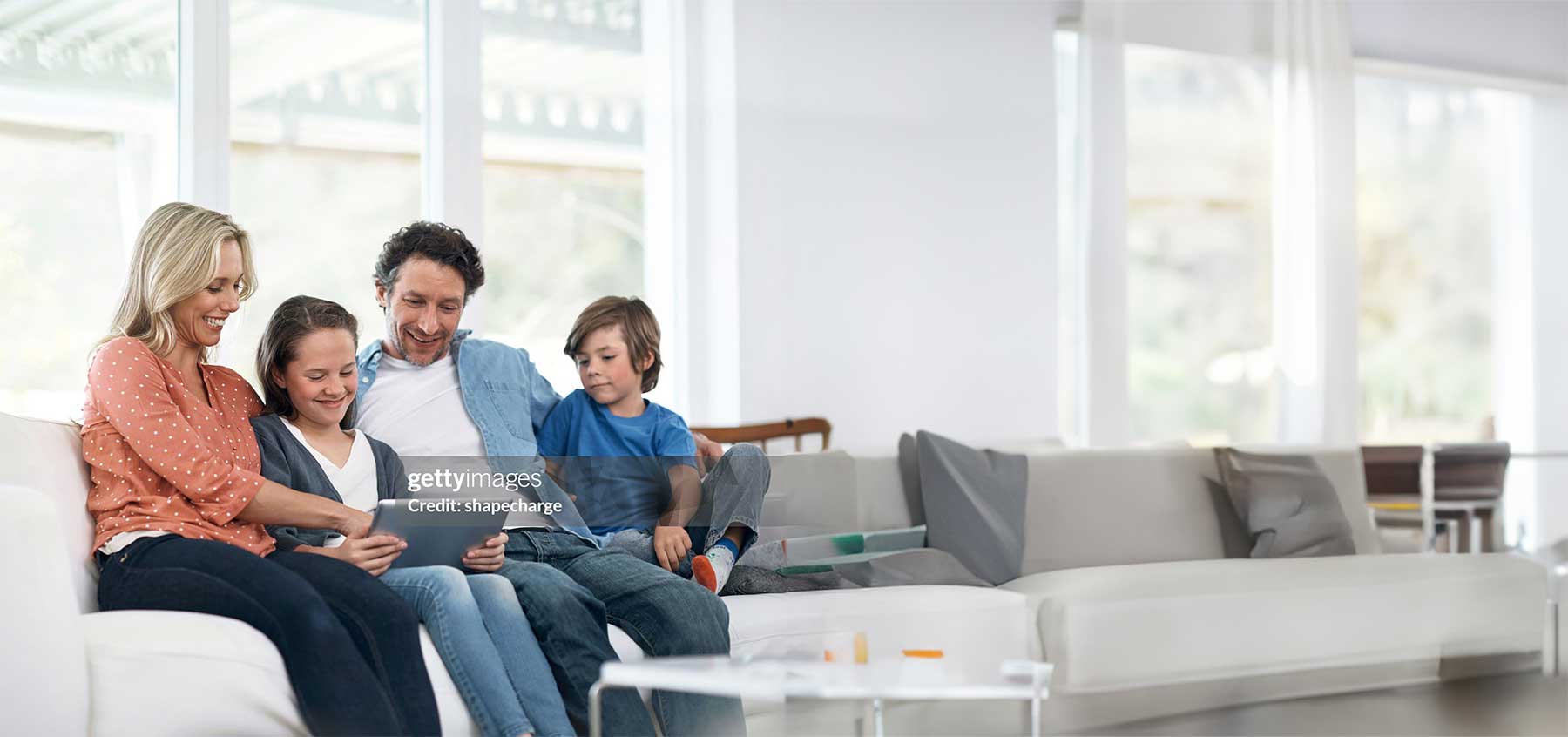 Family sitting together on a couch