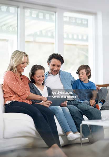 Family sitting together on a couch